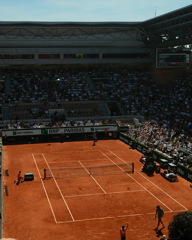 A match on the clay of Court Suzanne-Lenglen at Roland-Garros, seen from high in the stands